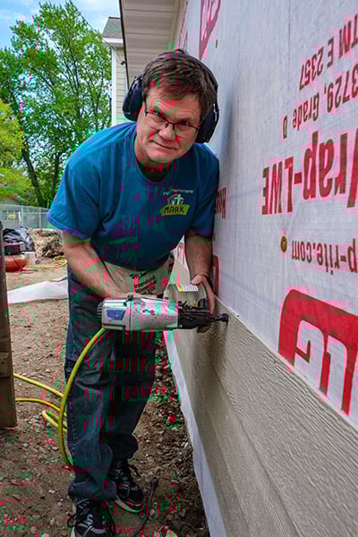 volunteer with nail gun