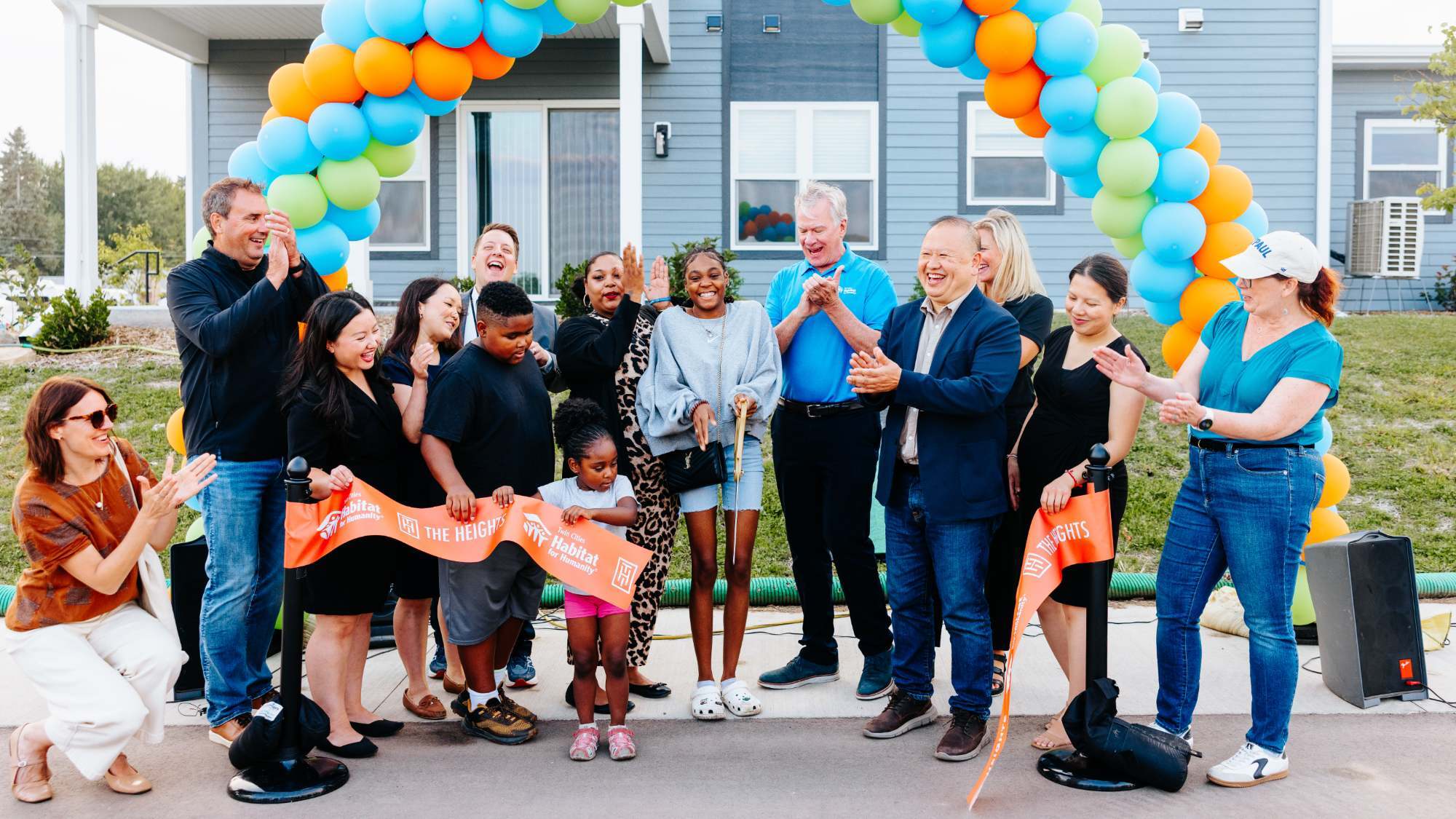Ribbon-cutting photo with group.