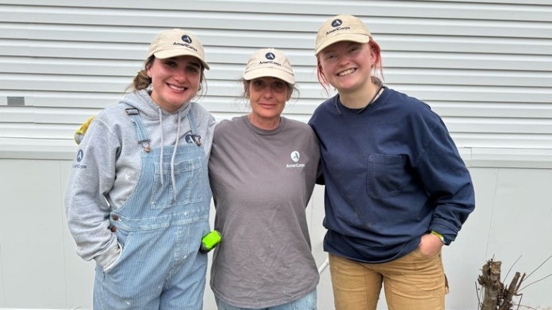 Three AmeriCorps women pose for a photo.