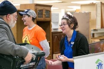 CJ_and_Anne_tabling_at_ReStore_sale