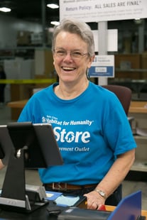 A ReStore volunteer at the cash register.