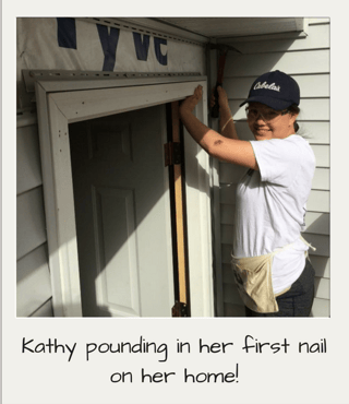 Kathy pounding in her first nail on her home!