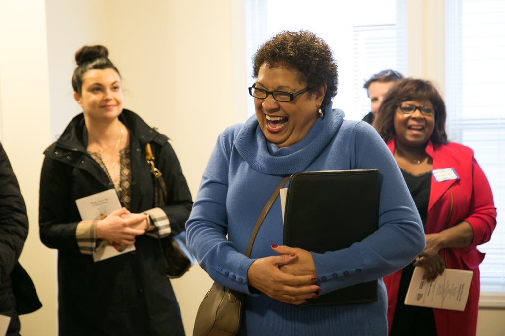 Linda White laughing at a Habitat home dedication.