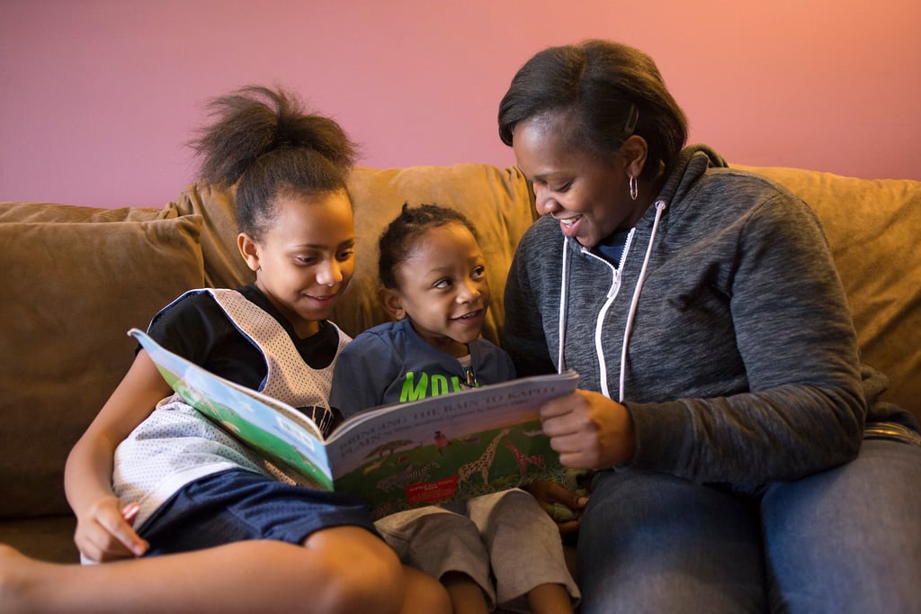 Simone and two of her kids on a couch