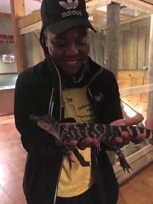 AmeriCorps member with alligator