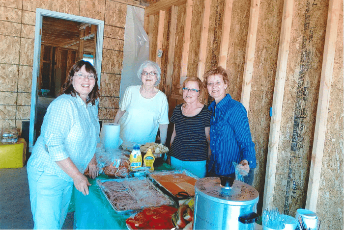 Jan and volunteers with the lunch they prepared.