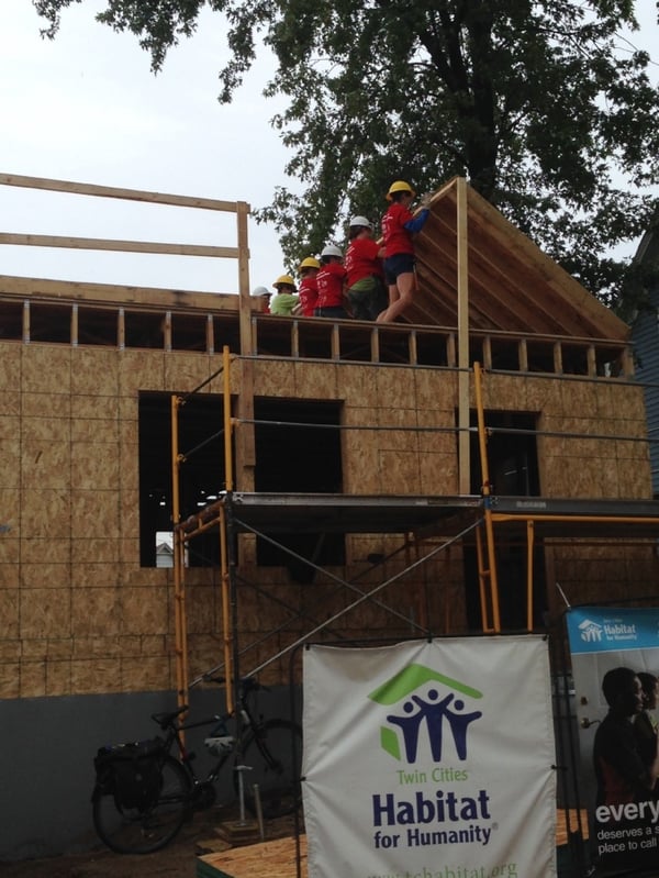 Women Build team raising a wall on the second floor