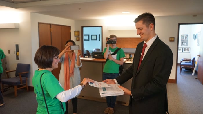 Sharing delivering her letter to a legislative aid.