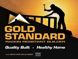 A black and gold-themed image, with the silhouette of someone working on a roof against a sunset. "Gold Standard radon resistant builder. Quality Built. Healthy Home. www.health.state.mn.us/radon"