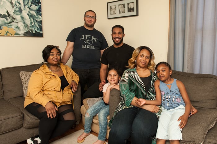 DeAngela and her family in their living room