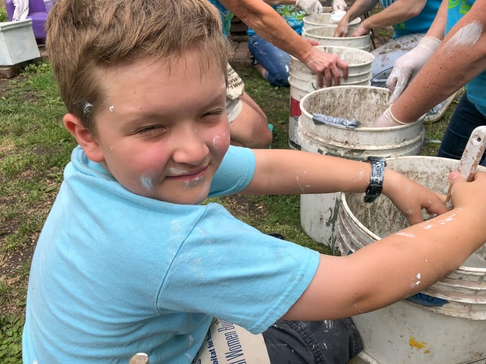 Erik helping the volunteers with paint