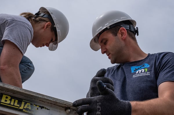 Representative Anne Neu (R-North Branch) working with Jake during the Red Blue Build.