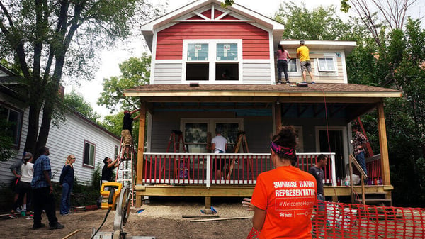 Sunrise volunteers getting close to the end of the build in 2016.