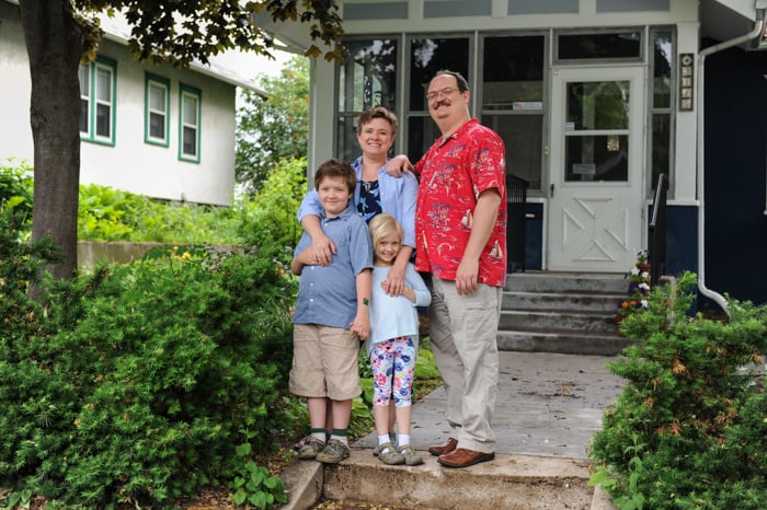 Beth's family in front of their home.