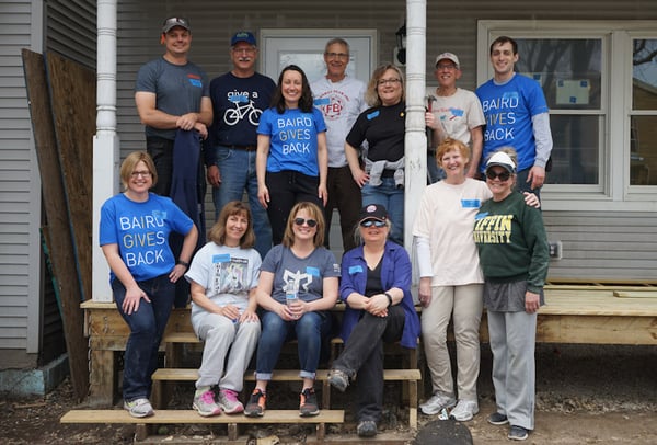 Group photo of the Baird group in a build site.