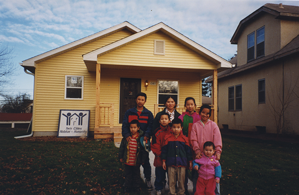 Naja's family in front of their new Habitat home - 1999