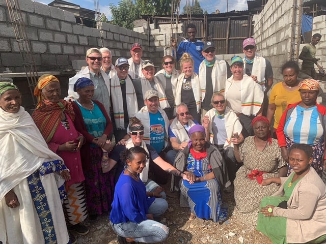 A group photo of the volunteers and homeowners in Addis Ababa.