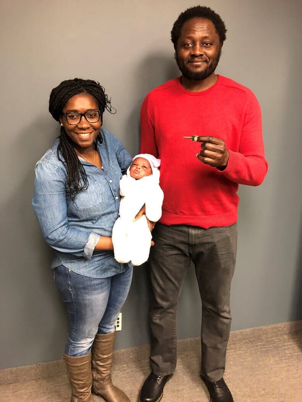 Marinette with her husband and child at their home closing.