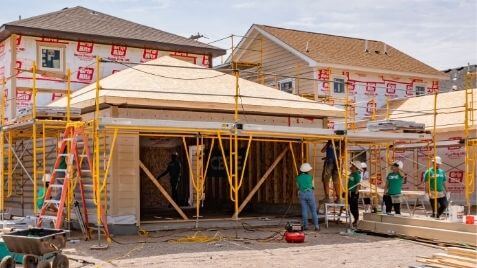 Volunteers outside of the Willow Reserve Build homes.