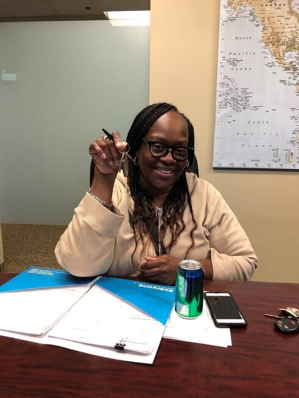 Wendy Mitchell holding her keys at her home closing.