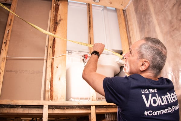 US Bank volunteer working on a Habitat house