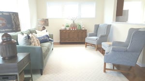 A living room with gray furniture.