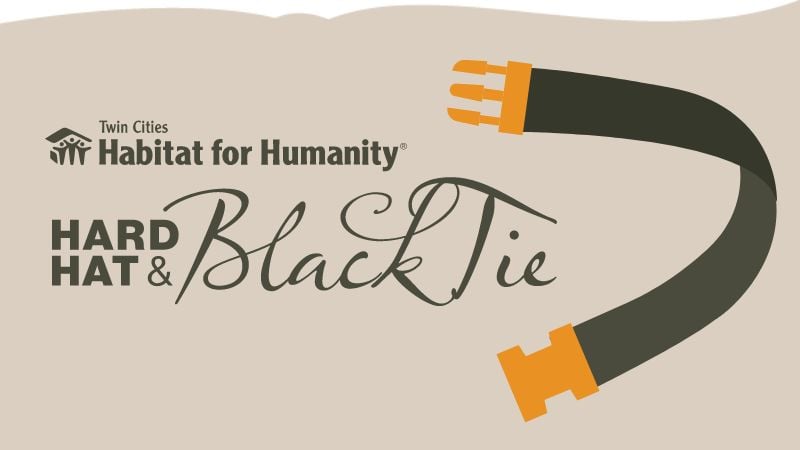 Hard hat and black tie logo.
