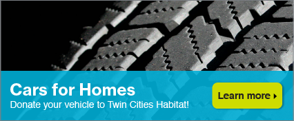 Close-up photo of tire with Cars for Homes text.