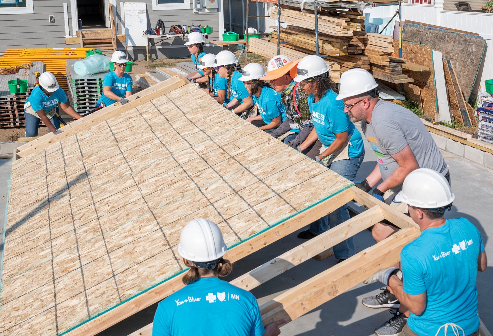 team lifting a wall