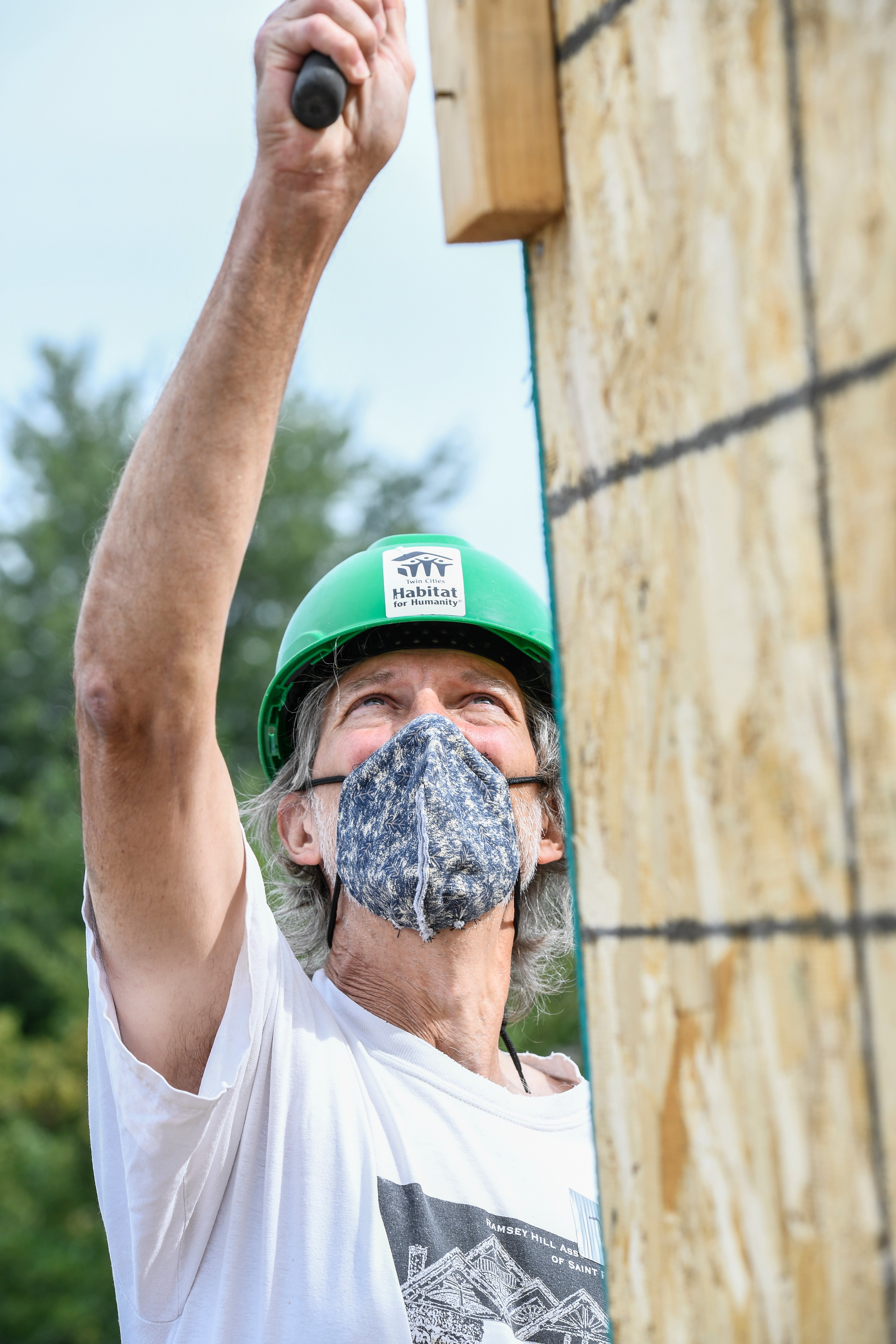 volunteer reaching up