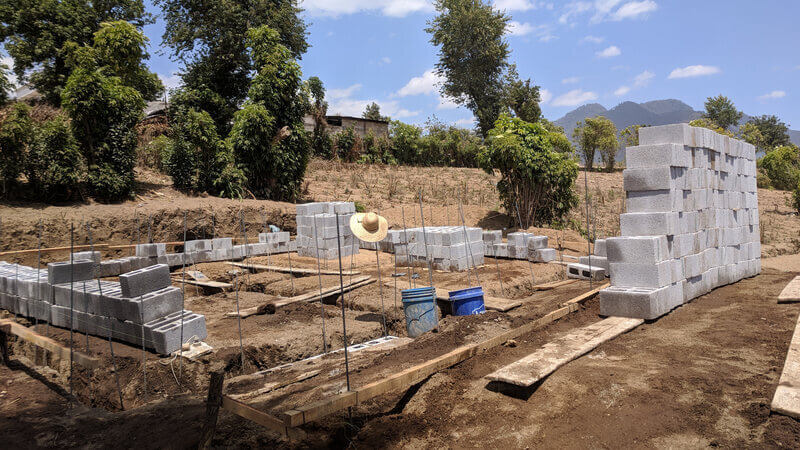 Concrete blocks laid out around a build site.