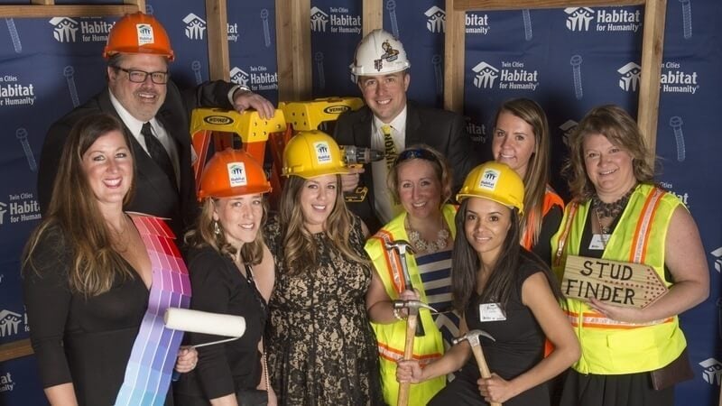 A group at the 2019 Hard Hat & Black Tie Gala, wearing a variety of construction-related costumes.