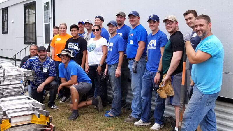 A group of volunteers outside Mark's home.