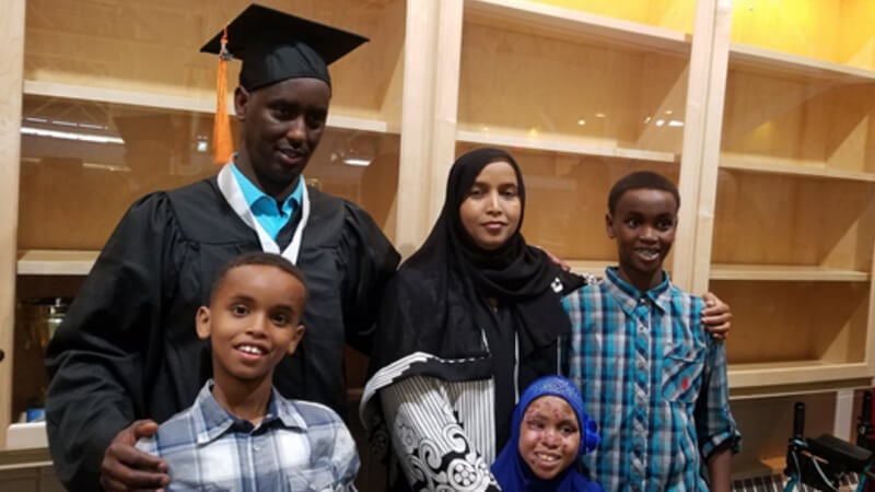 Mahdi and his family at his graduation.