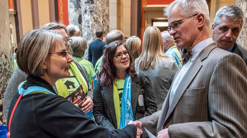 Habitat supporters meeting with a legislator at the state capitol.