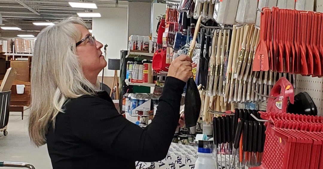 Volunteer Sue organizing tools at ReStore.
