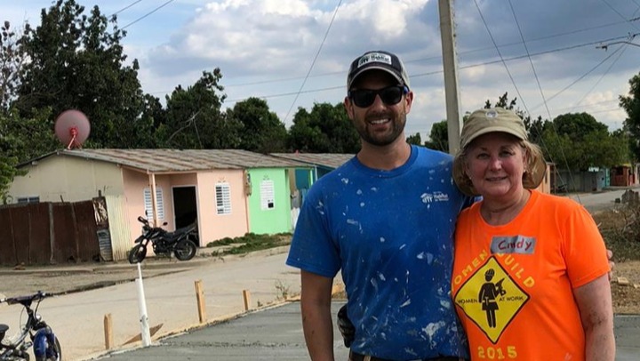 Cindy and son volunteering on site