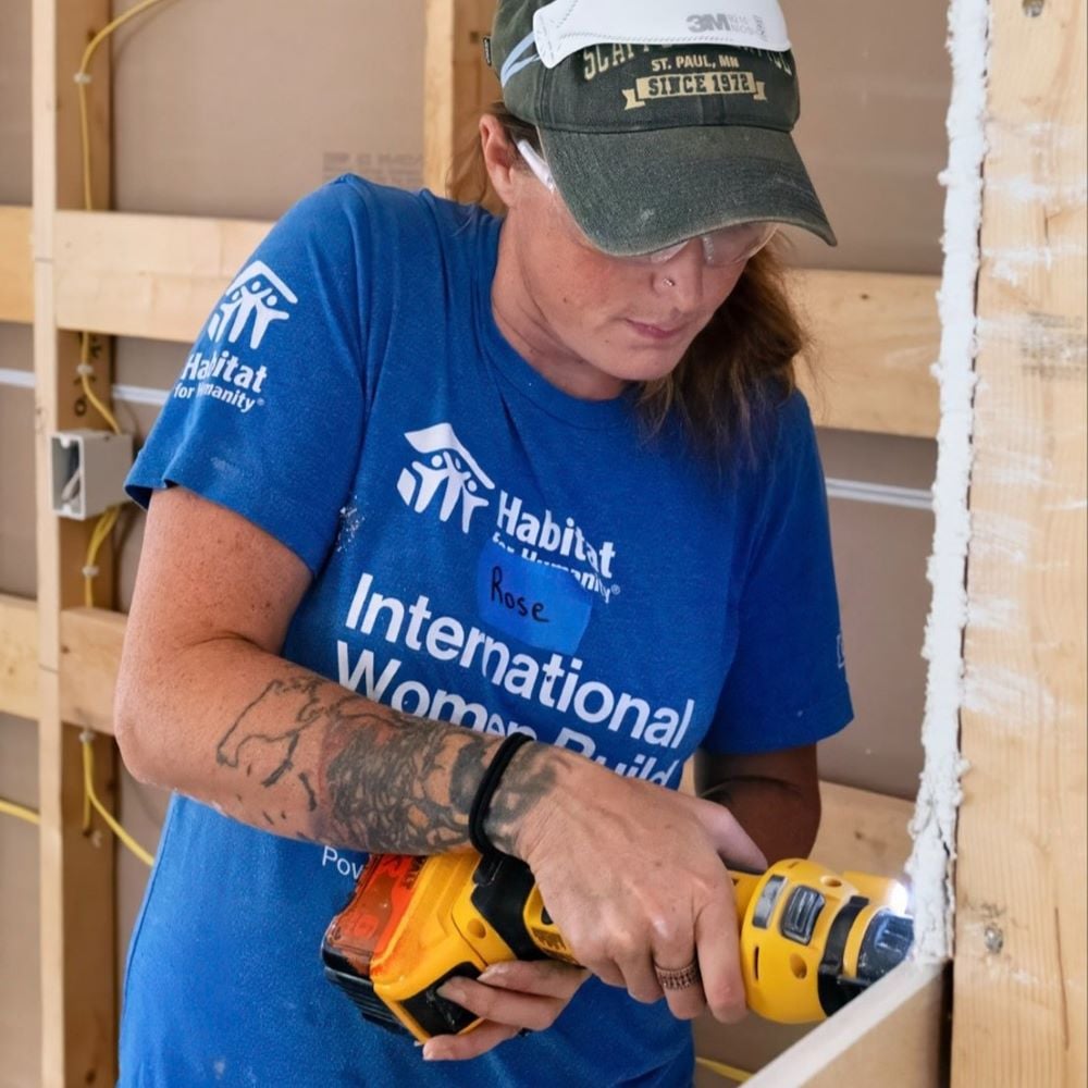 A woman using a power tool