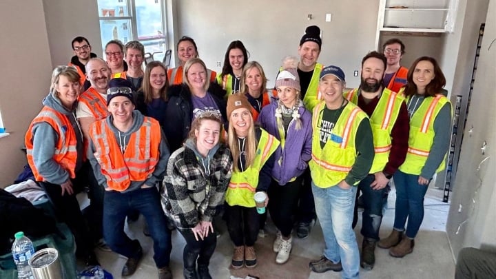 StoryTeller Media + Communications team at the Habitat for Humanity build site