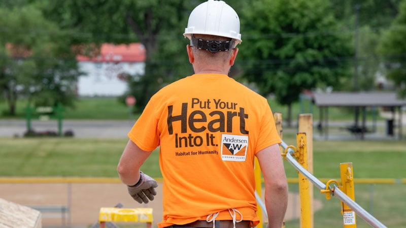 The back of a volunteer t-shirt that says Put Your Heart Into It.