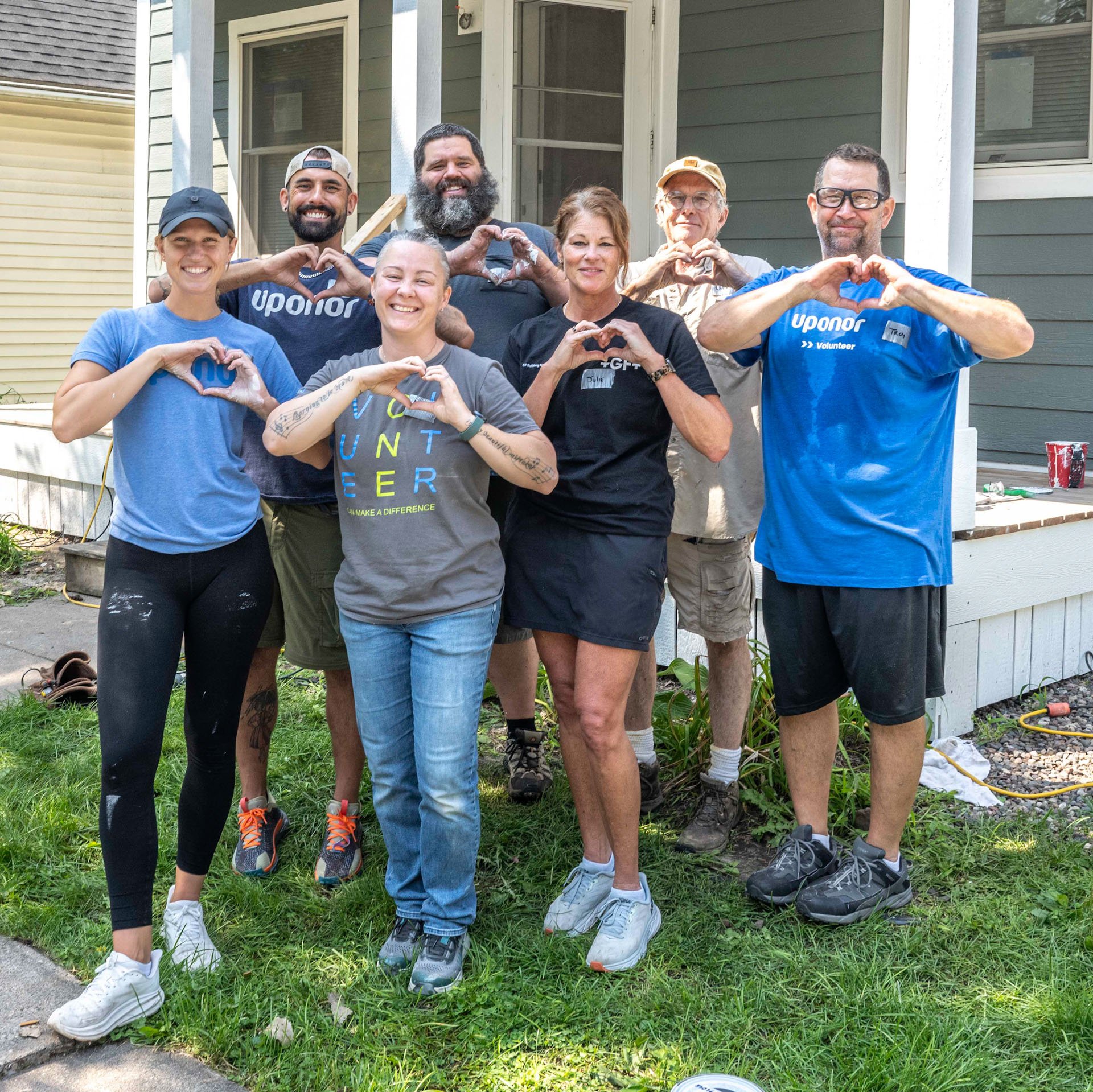 Volunteers making a heart shape