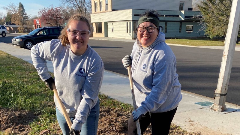 Theresa (left) and Jasmin (right) laying concrete.