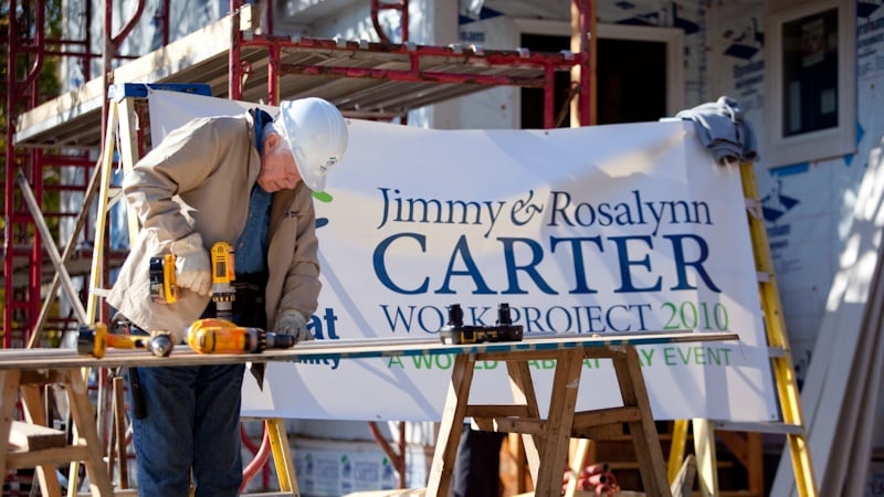 President Jimmy Carter using a drill in 2010.