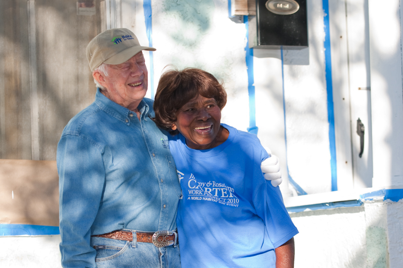 Jimmy Carter and a Habitat homeowner smile together at the 2010 Carter Work Project