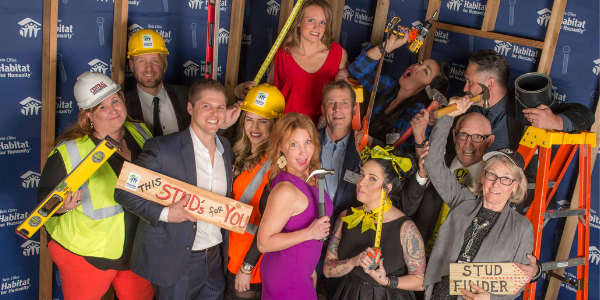 Hard Hat & Black Tie Gala attendees posing with props