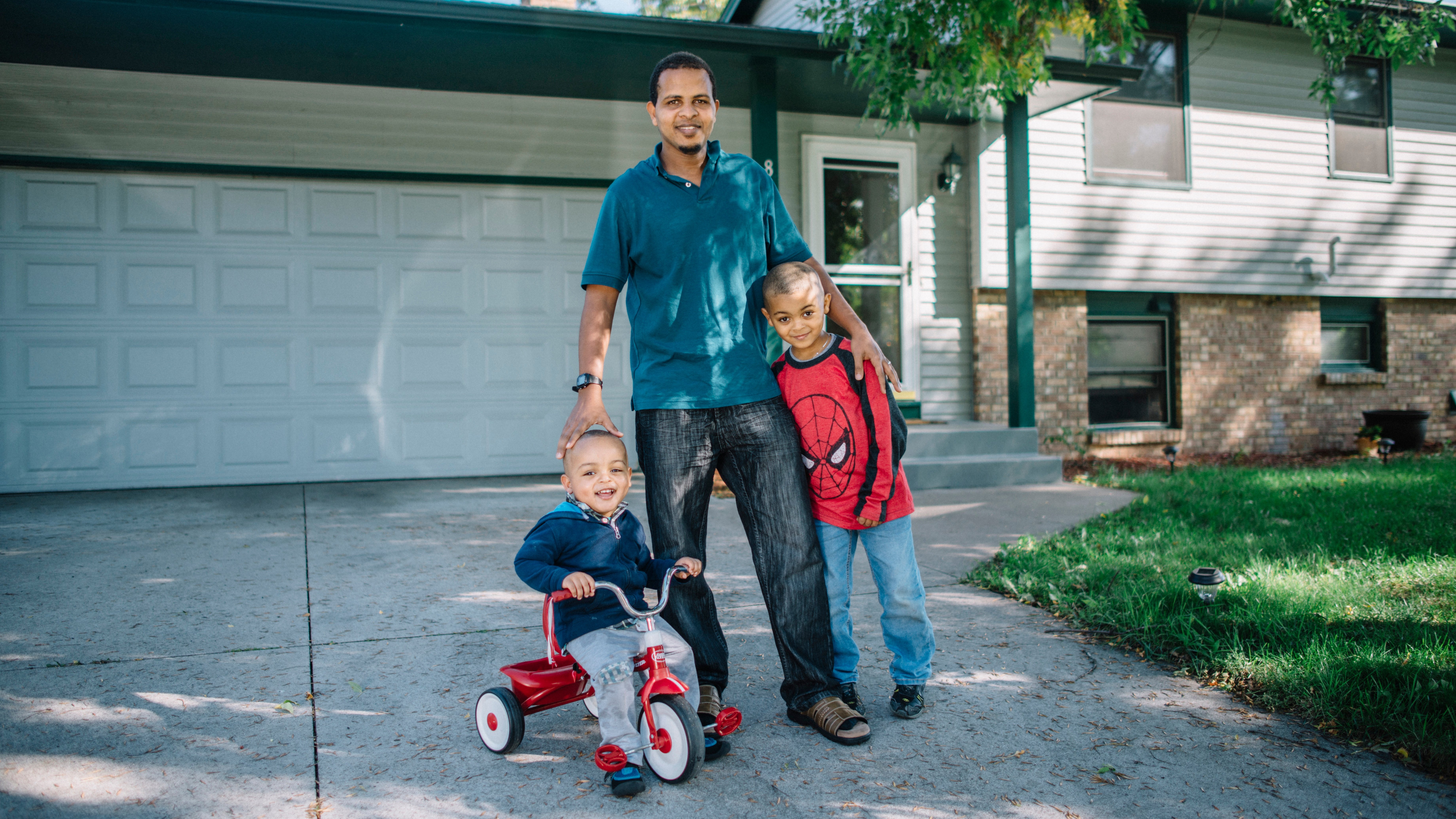 Habitat homebuyers in front of home.jpg