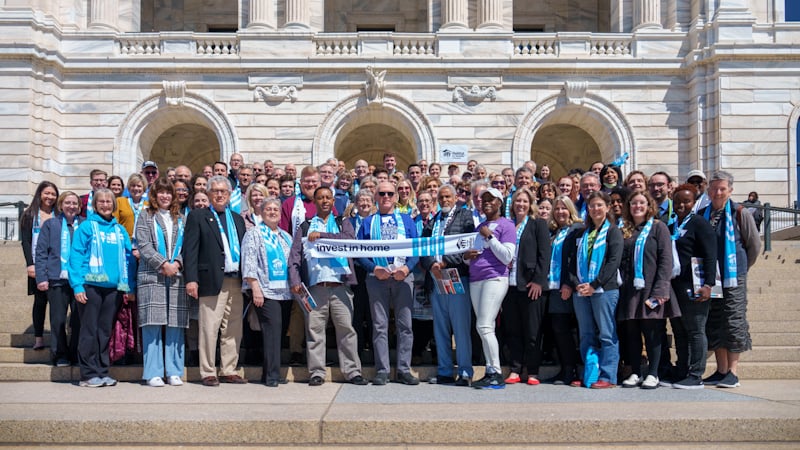 A big group of people on the steps of the Minnesota State Capitol