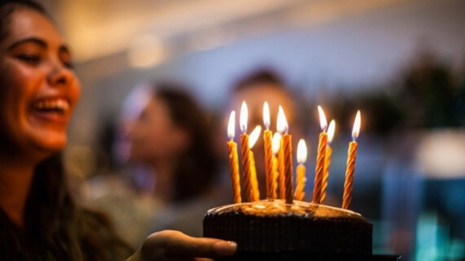 A young girl with a birthday cake.