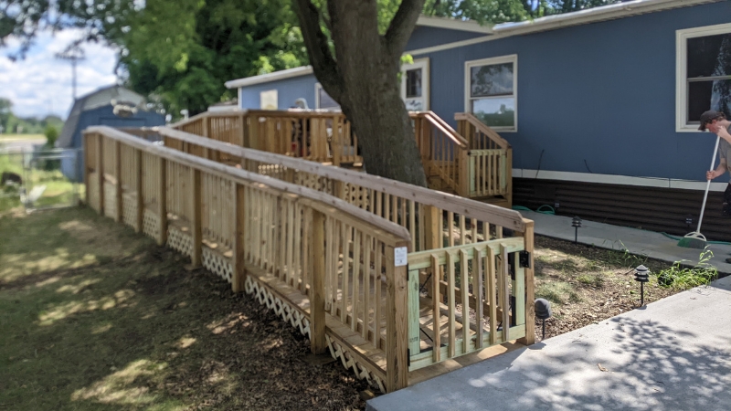 The new wooden ramp in front of John's home.