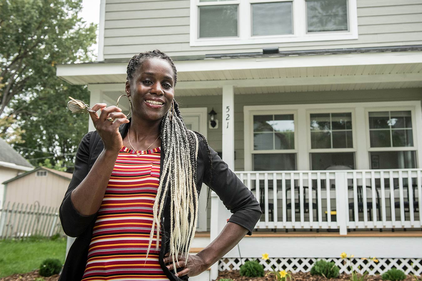 LeAndra-smiling-in-front-of-her-house-with-keys-in-hand---donate-page-2